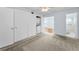 Bedroom featuring carpet, closet and an attached bathroom at 2460 Persian Dr # 54, Clearwater, FL 33763