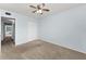 Comfortable bedroom with a ceiling fan, closet, neutral paint and plush carpeting at 2460 Persian Dr # 54, Clearwater, FL 33763
