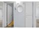 Hallway leading to a bathroom with built in cabinets and adjacent bedroom access at 2460 Persian Dr # 54, Clearwater, FL 33763