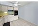 Well-lit kitchen area with appliances including microwave and oven, plus ample storage space at 2460 Persian Dr # 54, Clearwater, FL 33763
