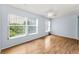 Bright and airy living room with large windows and views of the outdoor greenery at 2460 Persian Dr # 54, Clearwater, FL 33763