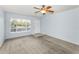 Open floor plan living room with ceiling fan and front door at 2460 Persian Dr # 54, Clearwater, FL 33763