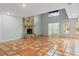Bright living room featuring terracotta tile flooring, a stone fireplace, and high ceilings at 2493 6Th Sw Ave, Largo, FL 33770