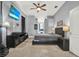 Bedroom featuring stylish furniture, a modern ceiling fan, and gray walls at 25330 Conestoga Dr, Land O Lakes, FL 34639