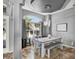 Dining room with natural light, modern light fixture, and stylish gray table at 25330 Conestoga Dr, Land O Lakes, FL 34639