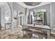Gray dining room featuring a decorative light fixture and view of front entrance at 25330 Conestoga Dr, Land O Lakes, FL 34639
