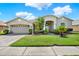 Charming single-Gathering home featuring a well-manicured lawn and inviting curb appeal at 25330 Conestoga Dr, Land O Lakes, FL 34639