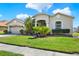 Charming single-Gathering home with a well-manicured lawn, mature landscaping, and a two-car garage at 25330 Conestoga Dr, Land O Lakes, FL 34639