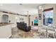 Open floor plan with tile flooring, breakfast nook, and modern furniture at 25330 Conestoga Dr, Land O Lakes, FL 34639