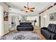 Open living area features hardwood floors, high ceilings, and a comfortable seating area at 25330 Conestoga Dr, Land O Lakes, FL 34639