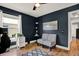 Home office featuring a ceiling fan, natural light, modern decor, and a comfortable area to work from home at 25330 Conestoga Dr, Land O Lakes, FL 34639