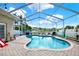 Enjoy this screened-in pool with pavers, a nice shape, and a lush landscape, perfect for relaxation and entertaining at 25330 Conestoga Dr, Land O Lakes, FL 34639