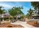 Neighborhood park featuring sidewalks, mature landscaping, park benches and lush surroundings at 3177 Montrose Pl, Palm Harbor, FL 34684
