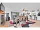 Open dining room with a view to the bar, fireplace, and outdoor space at 3177 Montrose Pl, Palm Harbor, FL 34684