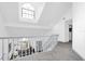 View of hallway featuring carpeted floors, high ceilings, and railings at 3177 Montrose Pl, Palm Harbor, FL 34684