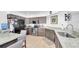 Modern kitchen with granite countertops, stainless steel appliances, and tile floors at 3177 Montrose Pl, Palm Harbor, FL 34684