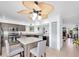 Open kitchen featuring granite island, stainless steel appliances, and tile floors at 3177 Montrose Pl, Palm Harbor, FL 34684