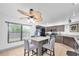 Spacious kitchen with granite island, tile floors, and stainless steel appliances at 3177 Montrose Pl, Palm Harbor, FL 34684