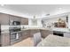 Kitchen area featuring stainless steel appliances and granite countertops at 3177 Montrose Pl, Palm Harbor, FL 34684