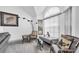 Bright seating area with large arched window, neutral colors, and decorative accents create a comfortable space at 3177 Montrose Pl, Palm Harbor, FL 34684