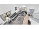 Aerial view of the open concept living room featuring large furniture and cathedral ceiling at 3177 Montrose Pl, Palm Harbor, FL 34684