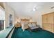 Main bedroom featuring a window seat, ceiling fan, and light wood furniture at 3177 Montrose Pl, Palm Harbor, FL 34684