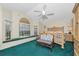 Bright main bedroom with a window seat, vaulted ceiling, and a ceiling fan at 3177 Montrose Pl, Palm Harbor, FL 34684