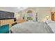 Relaxing main bedroom showcasing light gray bedding, carpeted floors, and natural light at 3177 Montrose Pl, Palm Harbor, FL 34684