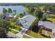 Stunning aerial view of a lakeside home with lush landscaping and a well-maintained yard at 3238 Cullendale Dr, Tampa, FL 33618
