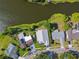 Aerial view of waterfront homes surrounded by lush landscaping and trees at 3238 Cullendale Dr, Tampa, FL 33618