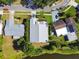 An aerial view shows a private home with lush landscaping and a serene waterfront view at 3238 Cullendale Dr, Tampa, FL 33618