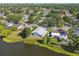 Aerial shot of a lakeside home featuring mature trees and community charm at 3238 Cullendale Dr, Tampa, FL 33618