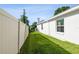 Side yard featuring a well-maintained lawn and privacy fence at 3238 Cullendale Dr, Tampa, FL 33618