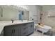 This bathroom features dual sinks, a claw foot tub, and glass shower with a gray vanity at 3238 Cullendale Dr, Tampa, FL 33618