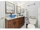 Elegant bathroom with unique vessel sinks, wood vanity, and modern fixtures at 3238 Cullendale Dr, Tampa, FL 33618
