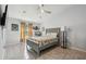 Well-lit bedroom featuring a comfortable bed, stylish decor, and a ceiling fan at 3238 Cullendale Dr, Tampa, FL 33618