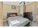 Cozy bedroom featuring a comfortable bed, ceiling fan, and ample storage space at 3238 Cullendale Dr, Tampa, FL 33618
