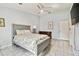 Bright bedroom with stylish bed frame, ceiling fan, and neutral color scheme at 3238 Cullendale Dr, Tampa, FL 33618