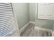 Walk-in closet featuring light wood-look tile flooring and white shelving with white walls at 3238 Cullendale Dr, Tampa, FL 33618