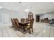 Bright dining room featuring a large table with seating for eight beneath an ornate light fixture at 3238 Cullendale Dr, Tampa, FL 33618