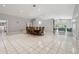 Open-concept dining area featuring a large dining table and access to multiple living spaces at 3238 Cullendale Dr, Tampa, FL 33618