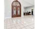 Entrance featuring ornate double doors and white tile flooring at 3238 Cullendale Dr, Tampa, FL 33618
