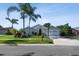 Charming home with well-kept lawn, palm trees, a basketball hoop, and inviting curb appeal at 3238 Cullendale Dr, Tampa, FL 33618