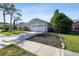 Spacious two-car garage with a long driveway and well-maintained landscaping at 3238 Cullendale Dr, Tampa, FL 33618