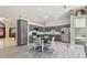 Open-concept kitchen with stainless steel appliances and gray cabinetry at 3238 Cullendale Dr, Tampa, FL 33618