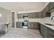 Modern kitchen boasts stainless steel appliances, gray cabinetry, and a stylish countertop with backsplash at 3238 Cullendale Dr, Tampa, FL 33618