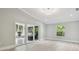 Bright, neutral room with sliding doors to a screened porch, showing indoor-outdoor living at 3238 Cullendale Dr, Tampa, FL 33618