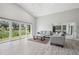 Bright living room with expansive windows offering serene views of the surrounding greenery at 3238 Cullendale Dr, Tampa, FL 33618