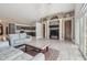 Bright, open living area with modern furnishings, stone accents, and seamless flow to the kitchen at 3238 Cullendale Dr, Tampa, FL 33618