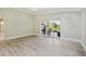 Open living room with laminate floors, sliding doors to an outdoor patio at 3238 Cullendale Dr, Tampa, FL 33618